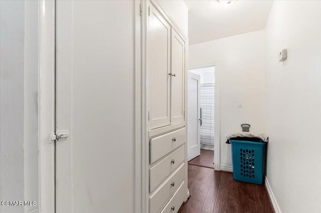 corridor with dark hardwood / wood-style floors