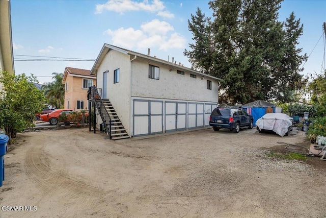 view of property exterior featuring a garage