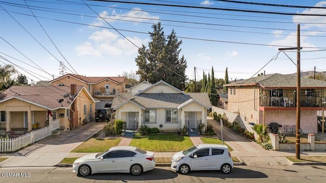 bungalow-style home with a front yard