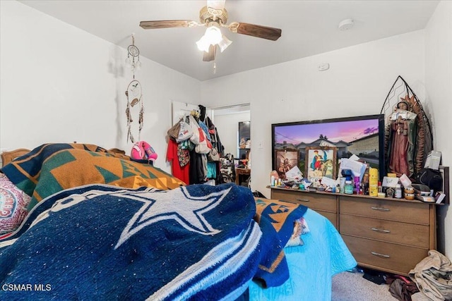 bedroom featuring ceiling fan and carpet floors