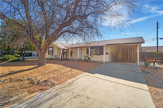 ranch-style house with a carport