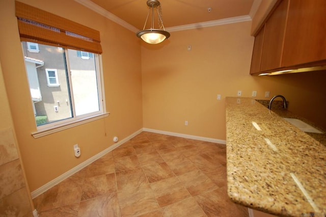 unfurnished dining area featuring crown molding