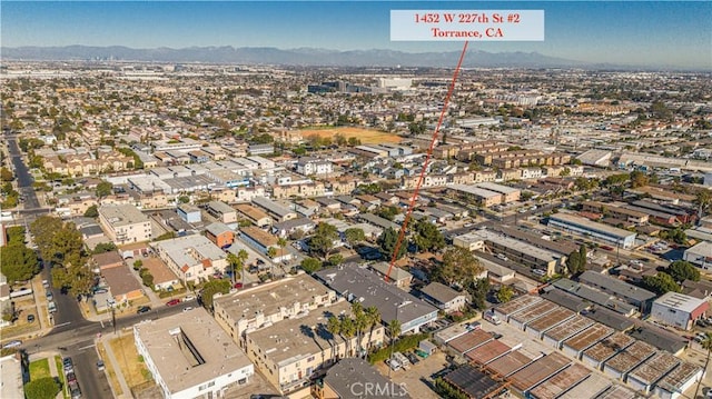 drone / aerial view featuring a mountain view