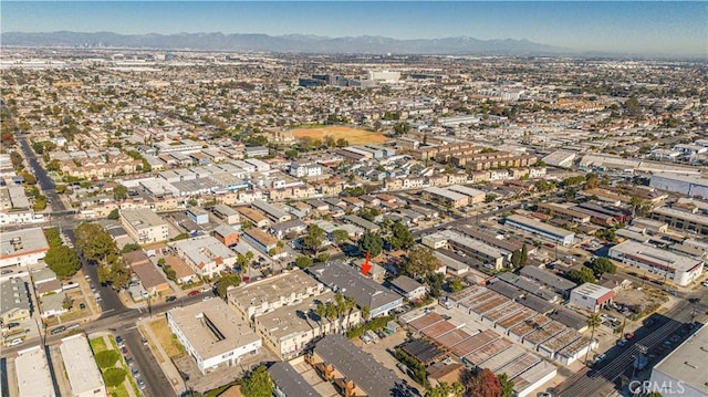 birds eye view of property with a mountain view