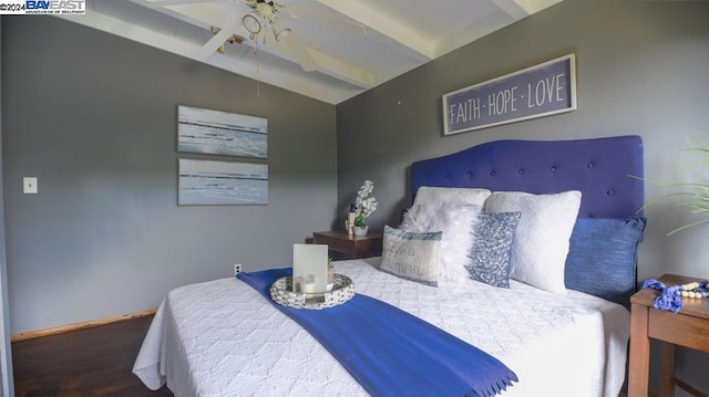 bedroom with vaulted ceiling with beams and wood-type flooring