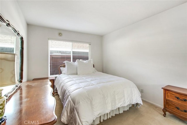 bedroom with light carpet