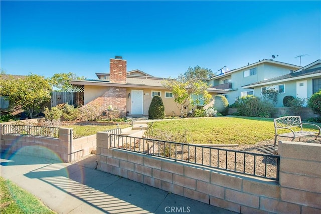 view of front of property with a front lawn