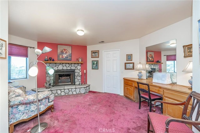 carpeted office space featuring a fireplace