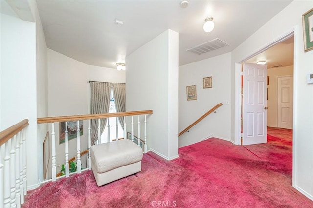 hallway with carpet