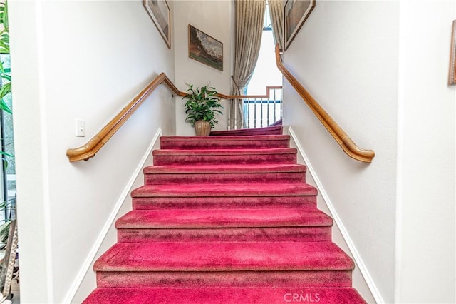 stairs featuring plenty of natural light