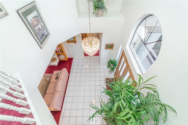 interior space with a chandelier and tile patterned flooring