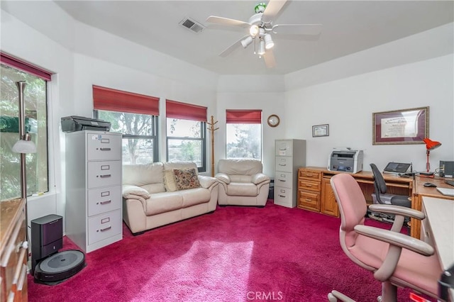 carpeted home office featuring ceiling fan and plenty of natural light