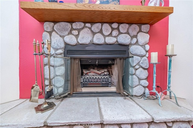 room details featuring a stone fireplace