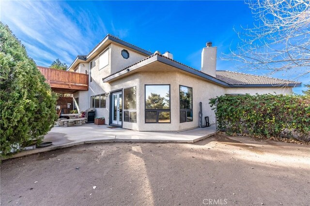 rear view of property with a patio