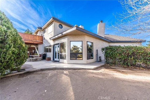 rear view of house with a patio