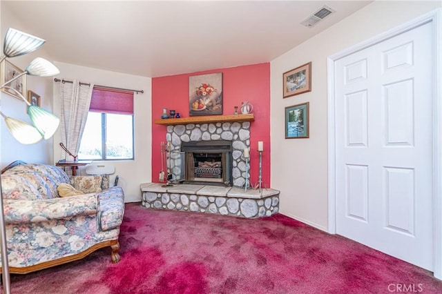 living room featuring carpet floors and a fireplace