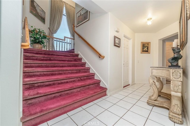 stairs featuring tile patterned floors