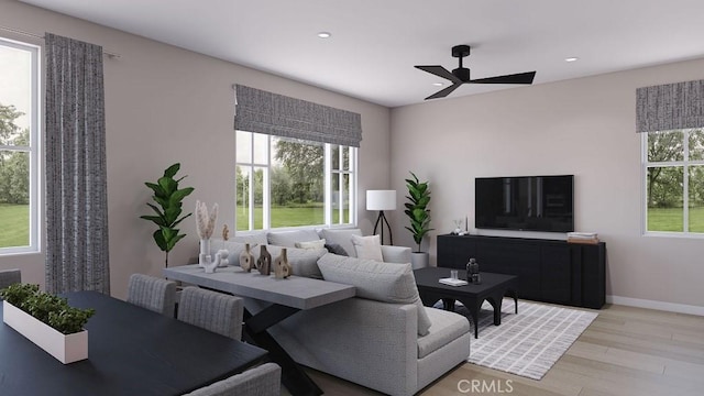 living room with ceiling fan and light wood-type flooring