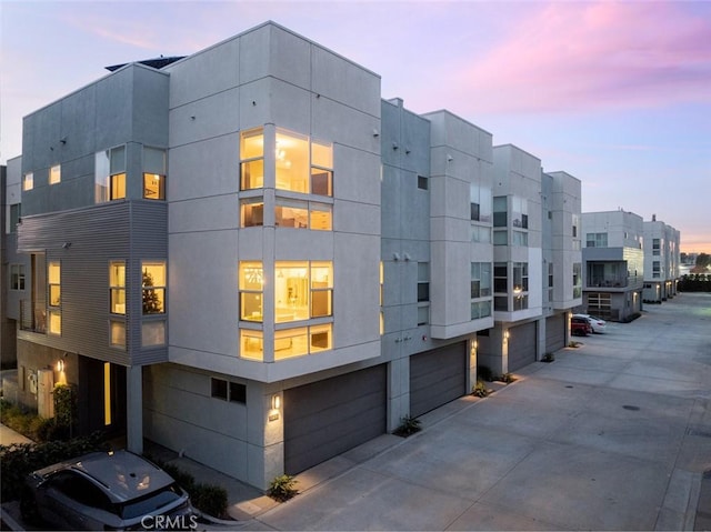 view of outdoor building at dusk