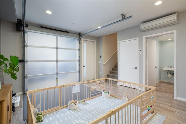 garage featuring an AC wall unit