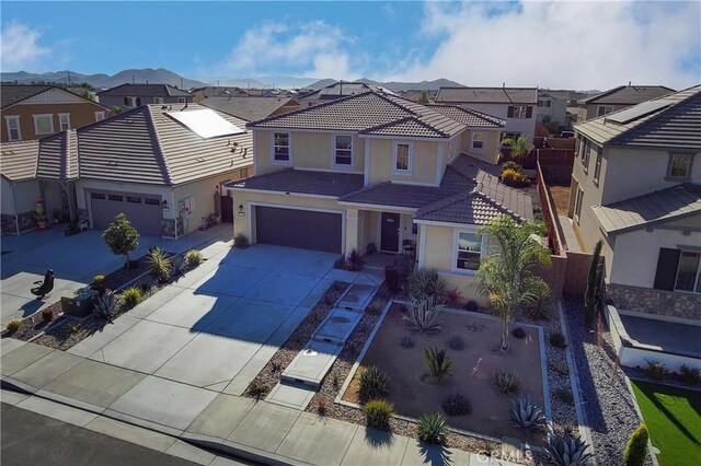 view of front of house with a mountain view and a garage