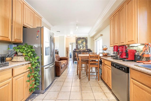 kitchen with light brown cabinets, appliances with stainless steel finishes, ornamental molding, and light tile patterned flooring