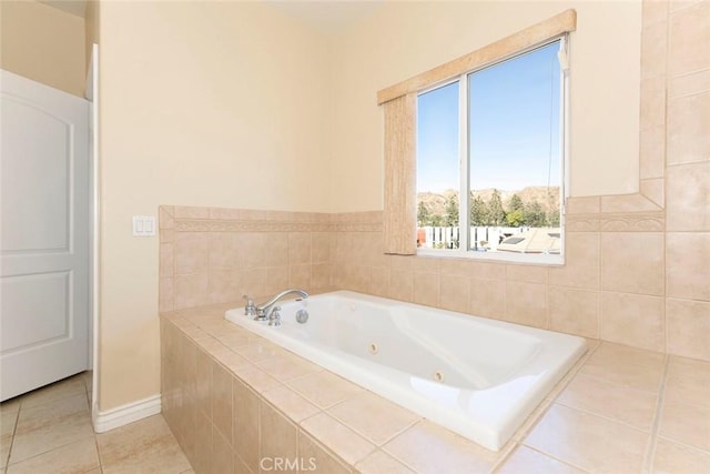 bathroom featuring tile patterned floors and a relaxing tiled tub