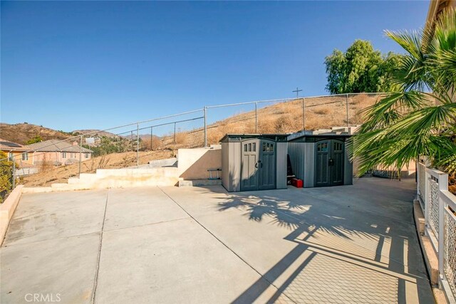 view of patio / terrace featuring a mountain view