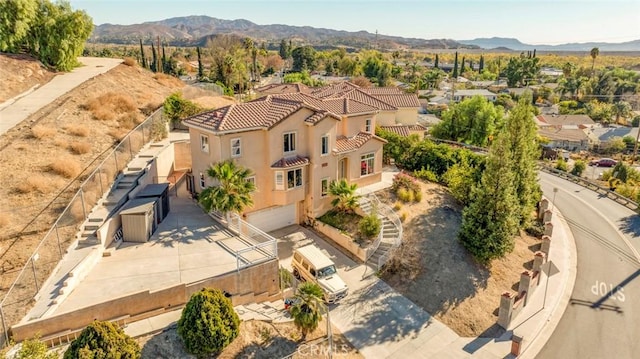 birds eye view of property with a mountain view