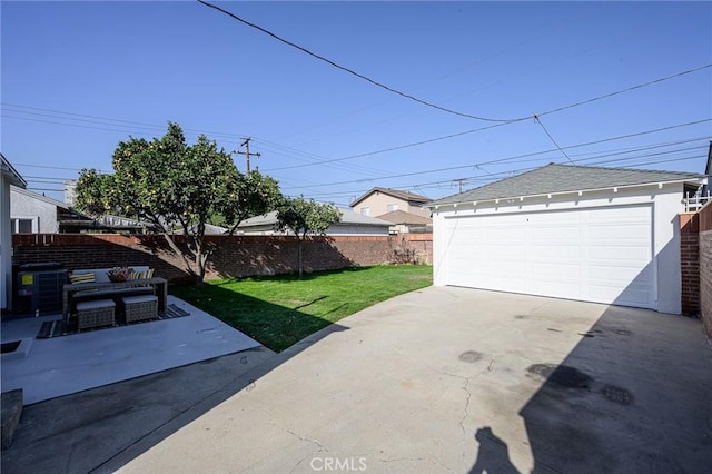 garage featuring a lawn and central AC