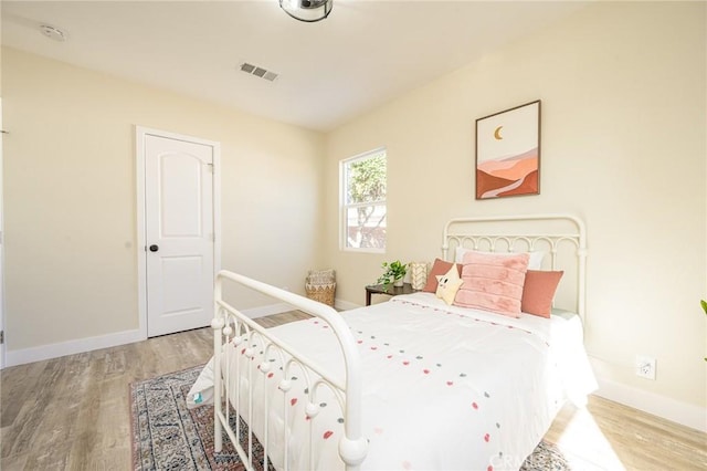 bedroom with light wood-type flooring