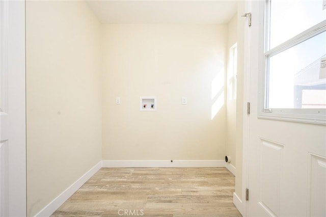 clothes washing area featuring light hardwood / wood-style flooring and hookup for a washing machine