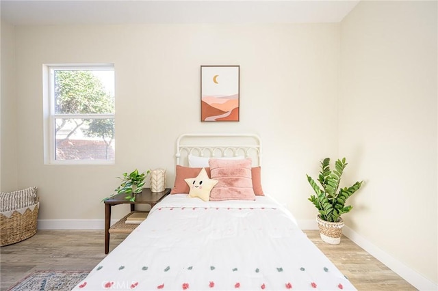 bedroom featuring hardwood / wood-style flooring