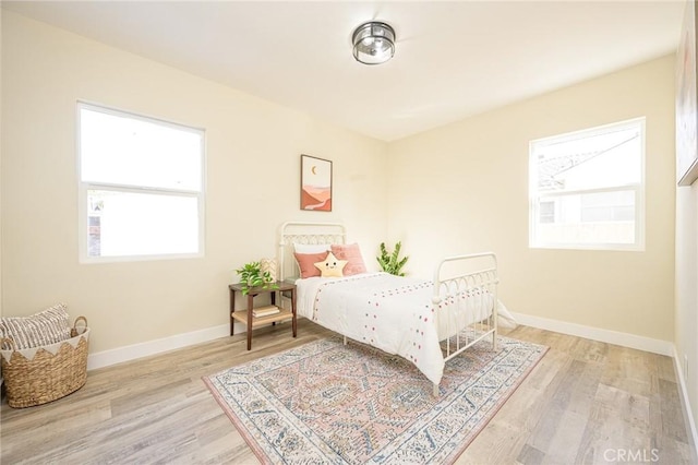 bedroom featuring light wood-type flooring