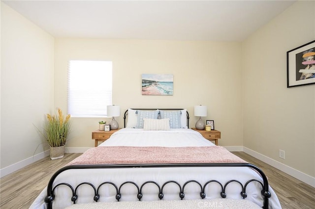 bedroom with light hardwood / wood-style flooring