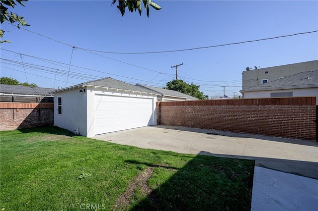 garage with a yard