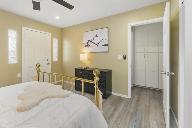 bedroom featuring light wood-type flooring and ceiling fan