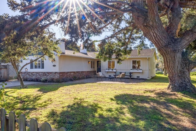 exterior space with a patio area and a front yard