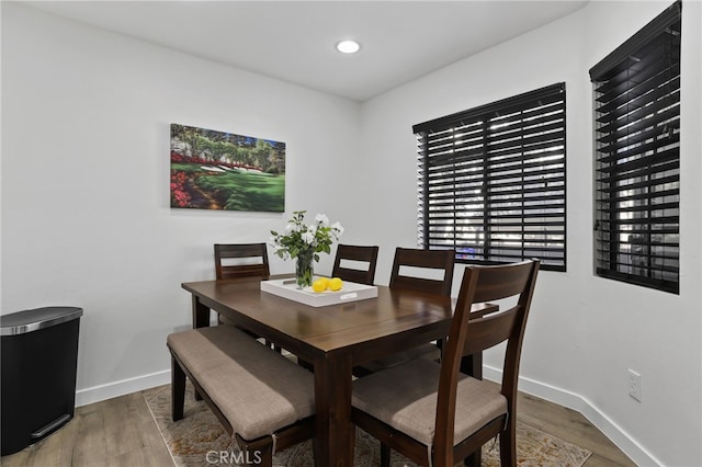 dining area with hardwood / wood-style flooring