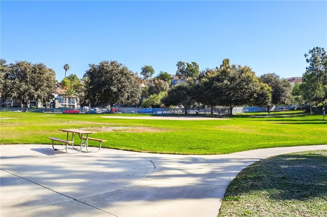 view of home's community featuring a lawn