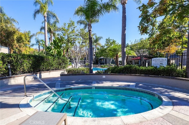 view of pool featuring a community hot tub