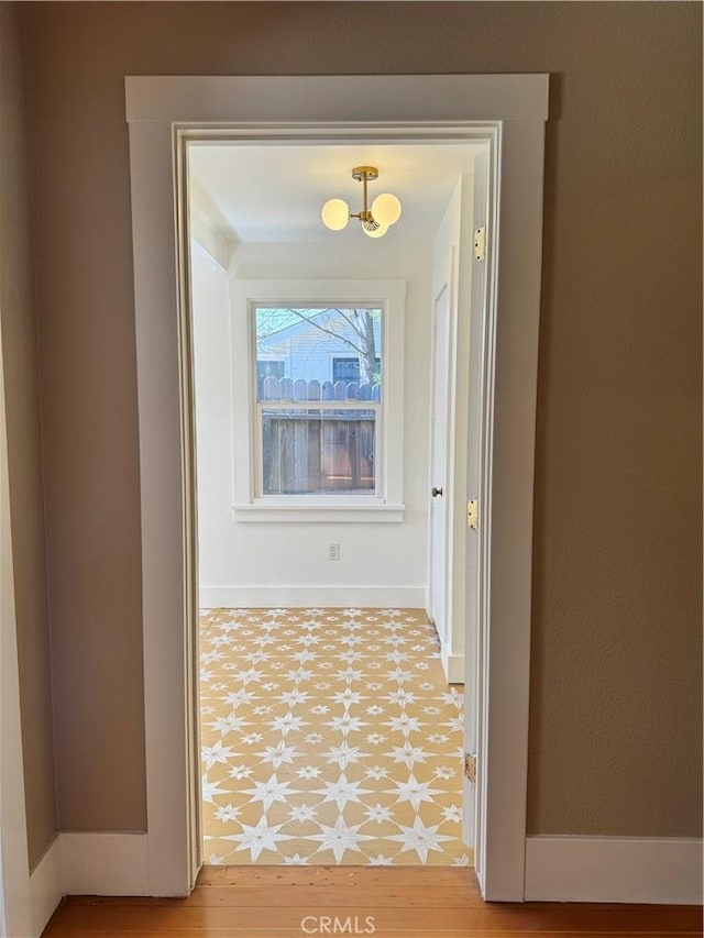 corridor featuring hardwood / wood-style flooring