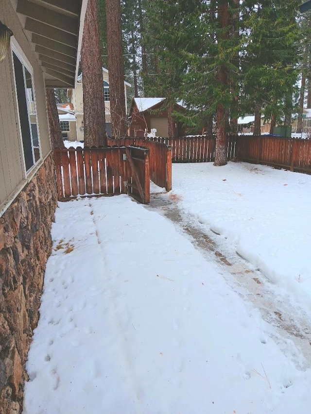 view of yard layered in snow