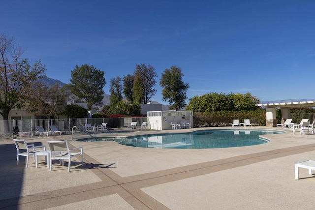 view of swimming pool with a patio