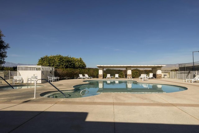 view of swimming pool featuring a patio area