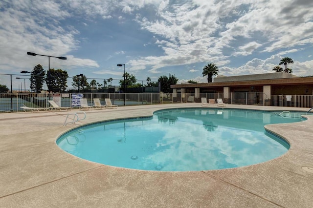 view of pool featuring a patio area