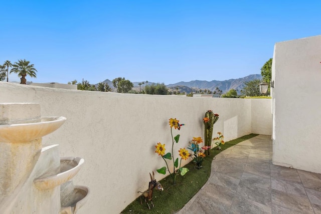 view of patio with a mountain view