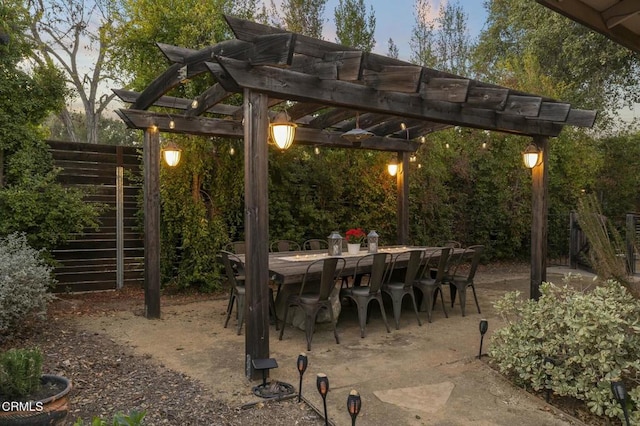 patio terrace at dusk with a pergola