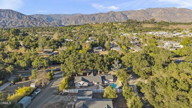 birds eye view of property with a mountain view