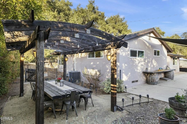 rear view of house with a patio, crawl space, fence, a pergola, and outdoor dining space